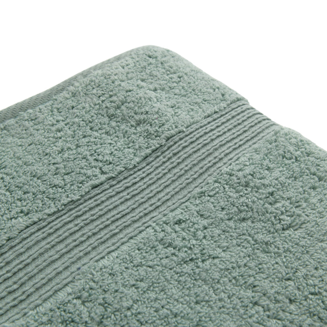 6_c758c873-0e30-4947-b35b-a214c45b821d-1 Close-up of a textured gray towel with a ribbed border.