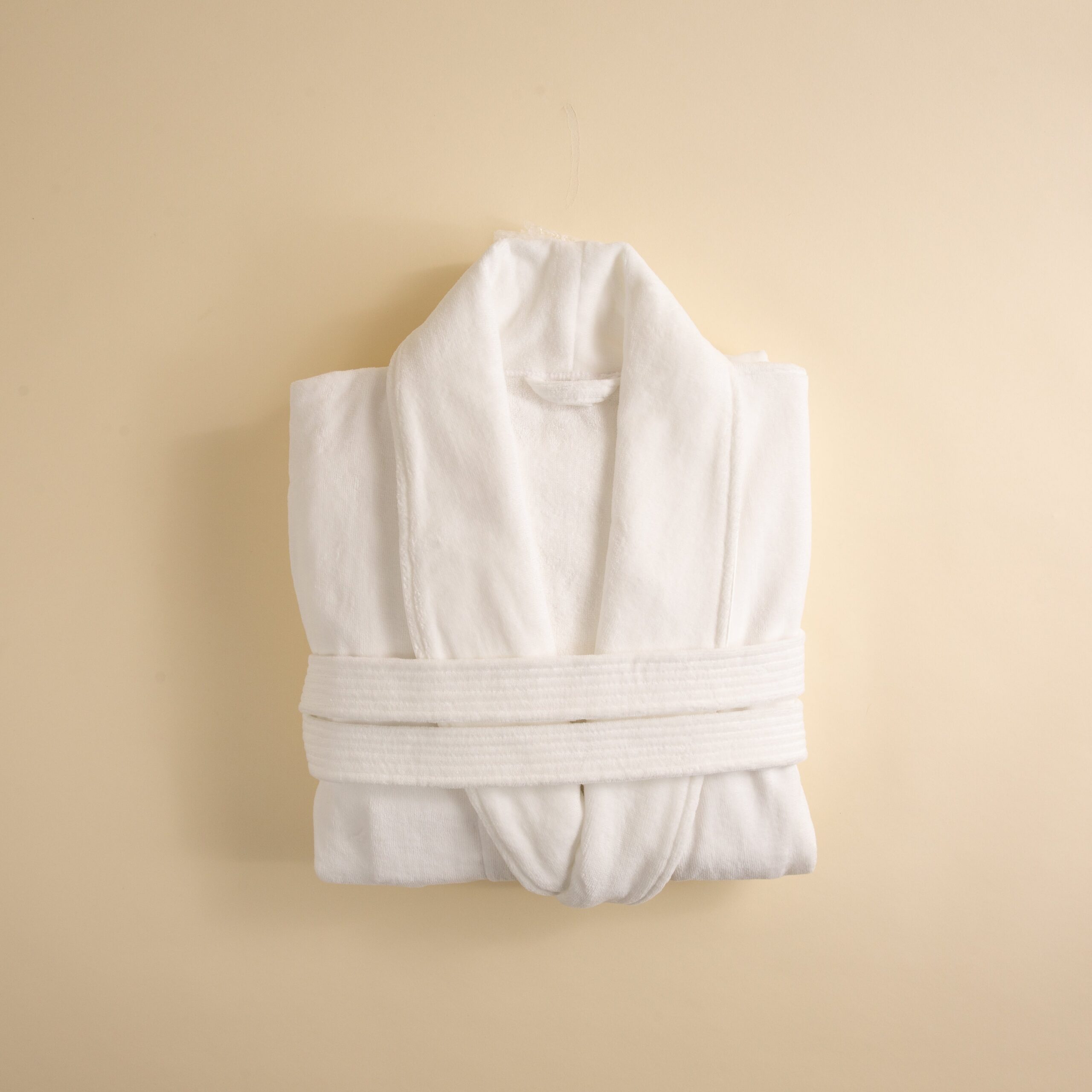 FineDetailsDay2-108 White bathrobe on a beige background