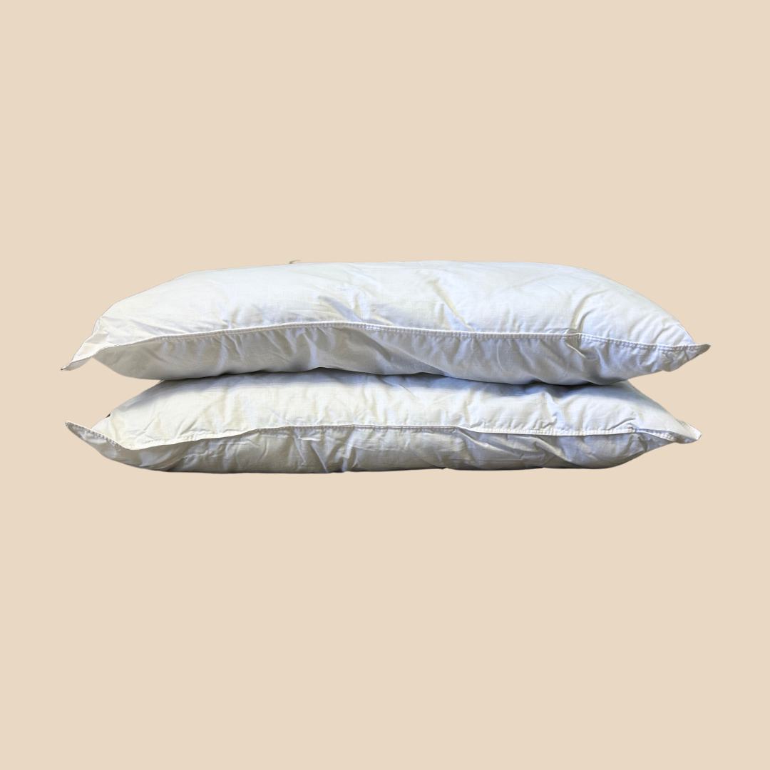 Shopify1080x1080 Stack of white towels on a light beige surface